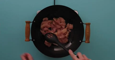 Stirring chicken while it cooks in a skillet 1 스톡 동영상 132199291