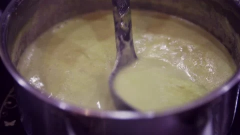 Stirring Up Chololate Milk on Saucepan Stock Footage 132022584