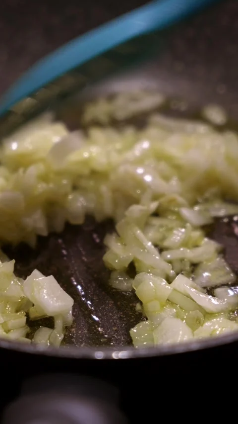 Stirring chopped onion in pan. Video stock 346620271