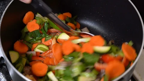 Stirring chopsuey vegetables in the pan Stock Footage 112747837