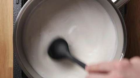 Stirring Coconut Milk With Sugar Using Silicone Spatula Top View Видео 335040788