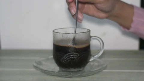 Stirring the Coffee in a Cup Stock Footage 127269572