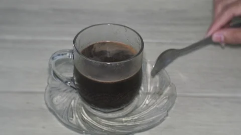 Stirring the coffee Stock Footage 127269633
