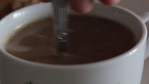 Stirring coffee with milk Stock Footage 109273387