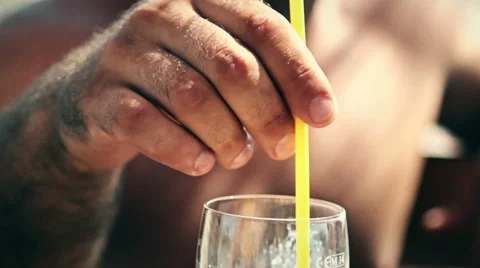 Stirring coffee with straw Stock Footage 65315722