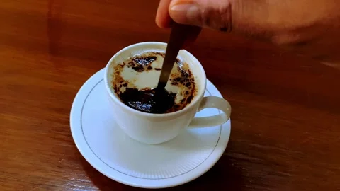 Stirring Coffee in a White Cup Stock Footage 341631406