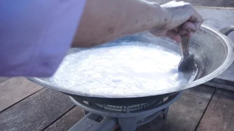 Stirring Cooking Batter in a Hot Pan, Traditional Cooking Process Stock Footage 301281441