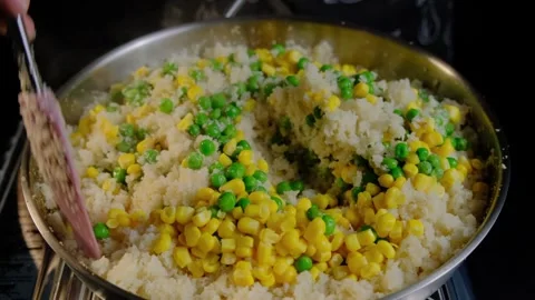 Stirring Corn and Peas in a Pan Cooking Video stock 341437601