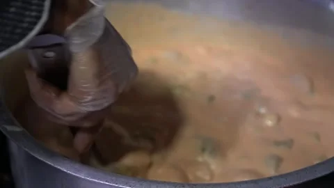 Stirring Creamy Mixture in a Pot Stock Footage 319949160