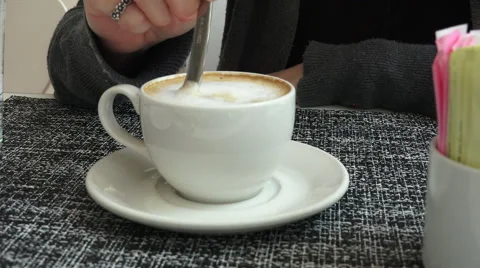 Stirring A Cup Of Cappuccino Video stock 52584898