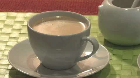 Stirring a cup of coffee Stock Footage 11877391