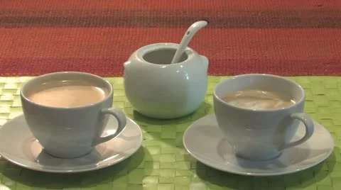 Stirring a cup of coffee Stock Footage 11877425