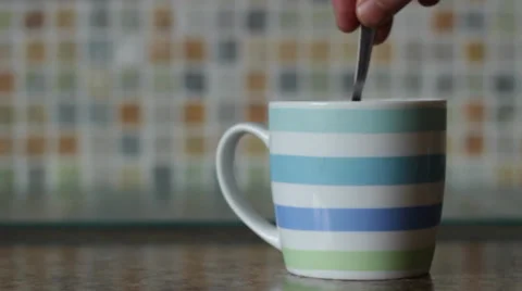 Stirring a cup of tea 動画素材 36032663