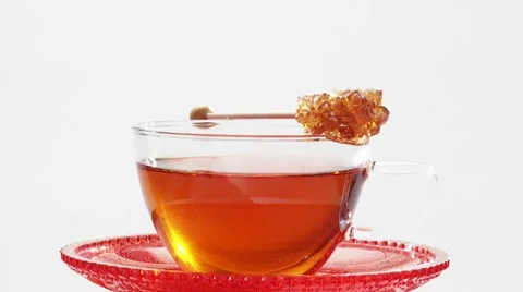 Stirring a cup of tea with a sugar swizzle stick Stock-Footage 8570962
