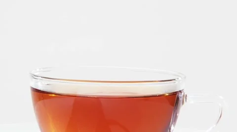 Stirring a cup of tea with a sugar swizzle stick Stock-Footage 8570963