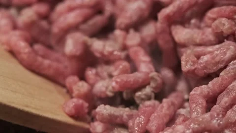 Stirring Delicious Red Minced Beef Meat with Wooden Spoon. Macro View Food Stock Footage 145748915