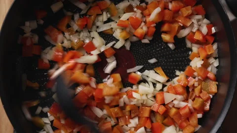Stirring Diced Onion and Red Bell Pepper with Silicone Spoon in Pan Close Up 스톡 동영상 336575579