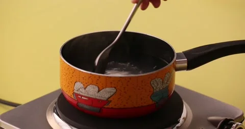Stirring egg in a pot of boiling water 2 Stock-Footage 132147360