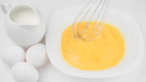 Stirring eggs with whisk Vídeos de archivo 221394169