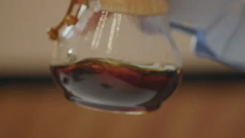 Stirring espresso in cup brewer, 4k slow motion Stock Footage 98881699