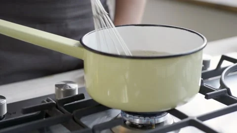 Stirring fast in pan Stock Footage 140268388