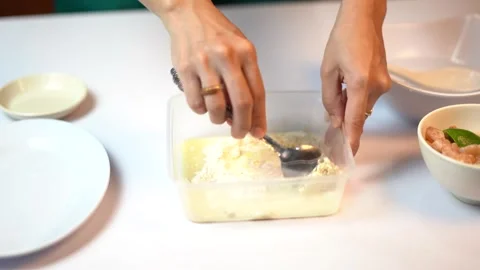 Stirring Flour and Egg Batter for Crispy Fried Shrimp Preparation 스톡 동영상 334305668