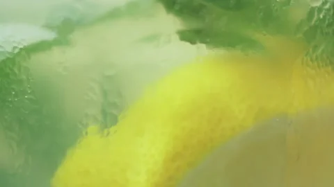 Stirring fresh cold lemonade with a spoon, macro shot. Stock Footage 138566141