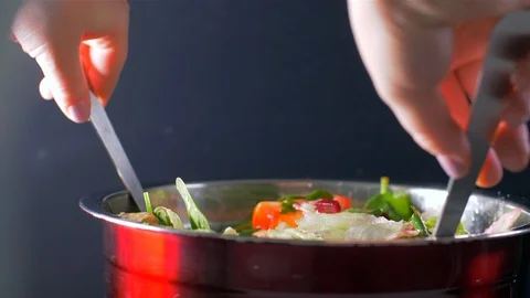 Stirring the fresh salad. Salad with beets and baby spinach Stock Footage 108146334