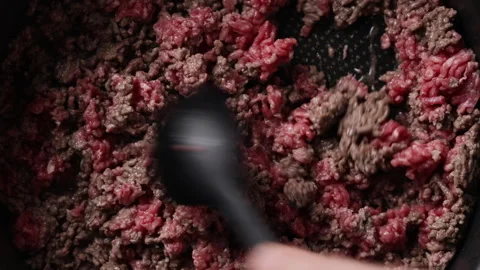 Stirring Ground Beef with Silicone Spoon in Pan Extreme Close Up Top View Видео 336577274