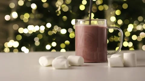 Stirring Hot Cocoa with Marshmallows on Cozy Christmas Background Stock Footage 324785231