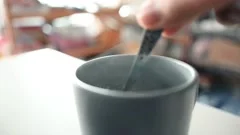 https://images.pond5.com/stirring-hot-coffee-cup-spoon-footage-143687234_iconm.jpeg