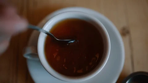Stirring a Hot Cup of Tea Stock Footage 86074113