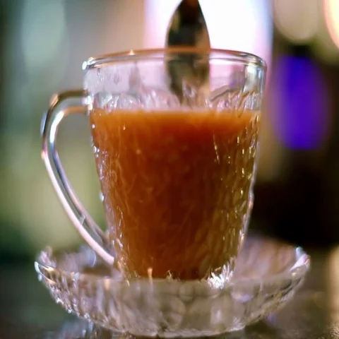 Stirring hot milk tea in cafe Stock Footage 69531357