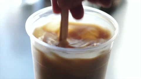 Stirring ice coffee Stock Footage 133534085