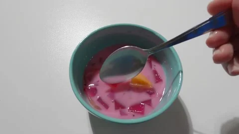 Stirring ice mix filled with pineapple jelly mango Stock Footage 158142133