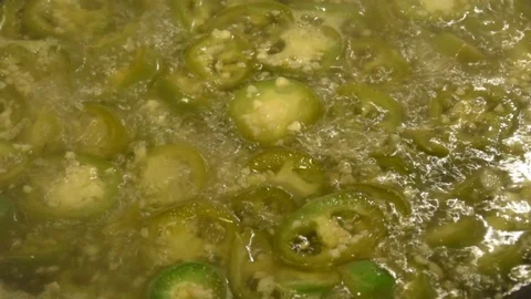 Stirring Jalapenos in Water Stock Footage 90086875