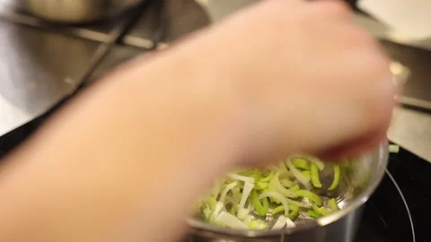 Stirring leeks, Garlic pan, Sliced leeks Stock Footage 276186495