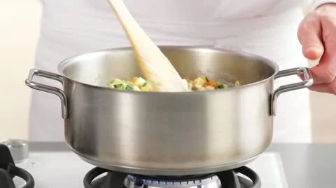 Stirring lentil stew Stock Footage 24662228