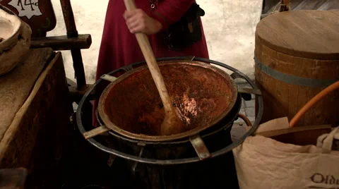 Stirring a medieval pot Stock Footage 54621813