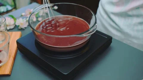 Stirring milk and cocoa on a kitchen stove Stock-Footage 249079690