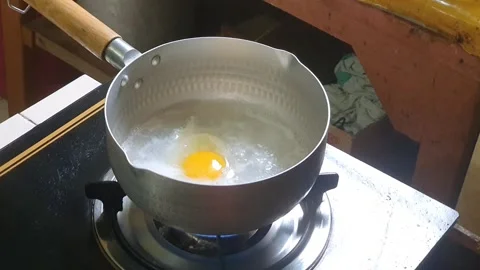 Stirring to mixed egg or beaten egg or whisked egg for cooking scramble egg.. Stock Footage 279295213