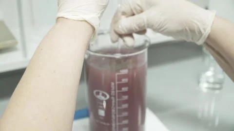 Stirring a mixture sample for aerated concrete Stock Footage 304360668