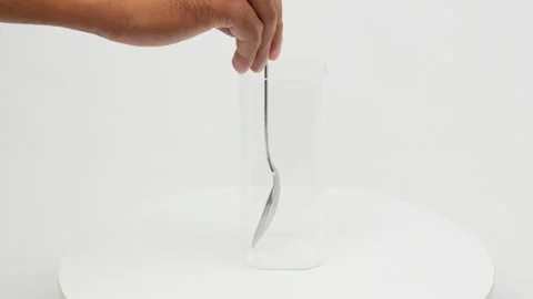Stirring Motion Inside a Clear Glass Video stock 327848828