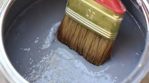 Stirring paint with brush Stock Footage 52732722
