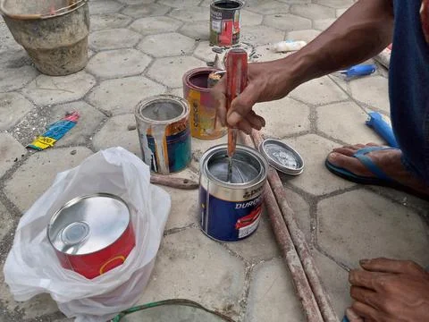 Stirring paint Stock Photos