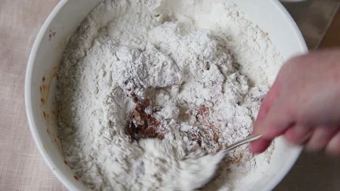 Stirring pecans into batter Stock Footage 102748707