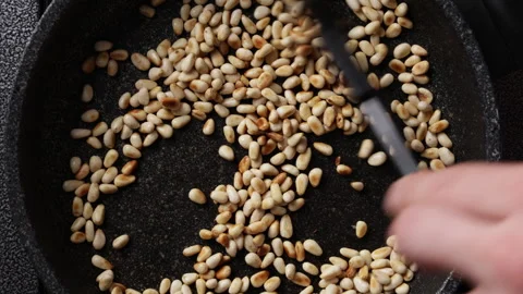 Stirring Pine Nuts Close Up Top View Видео 337190669