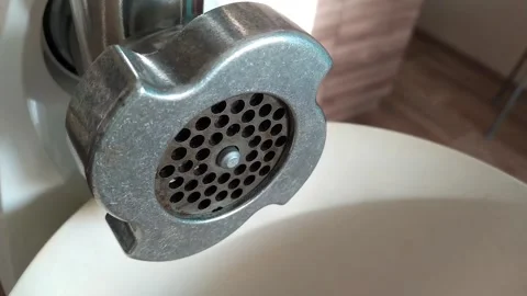 Stirring pork meat in a meat grinder. Stock Footage 130587452