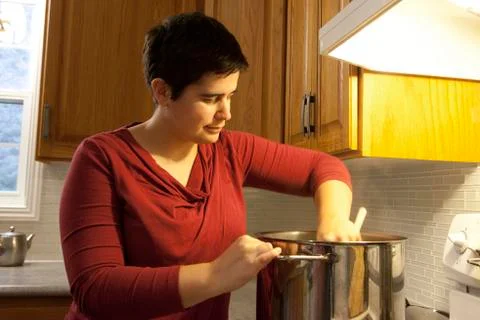 Stirring the pot Stock-Fotos