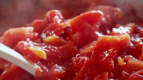 Stirring a pot of tomatoes prepared for canning. Stock Footage 41472345